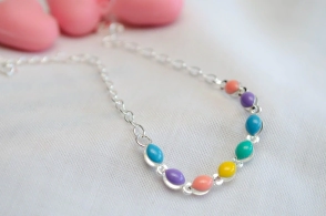 L-PU0065 Pulsera ovalos colores 18+4cm