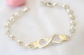 PU1303 Pulsera rolo 6 mm con centro infinito