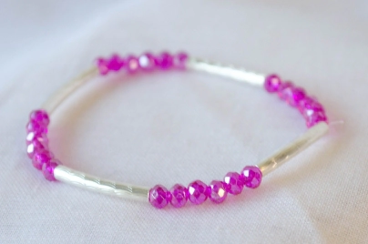 L-PU0150 Pulsera elastizada tubos cristales FUCSIA