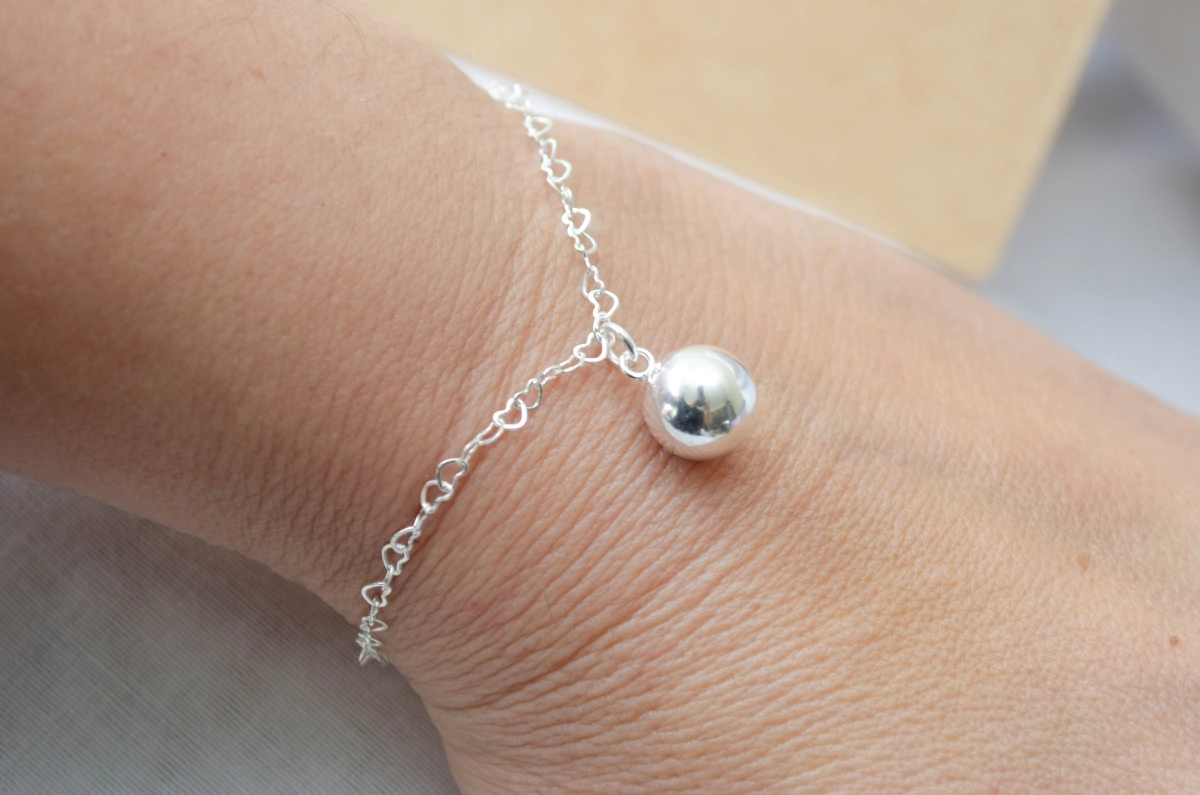 L-PU0192 Pulsera corazones con bola centro