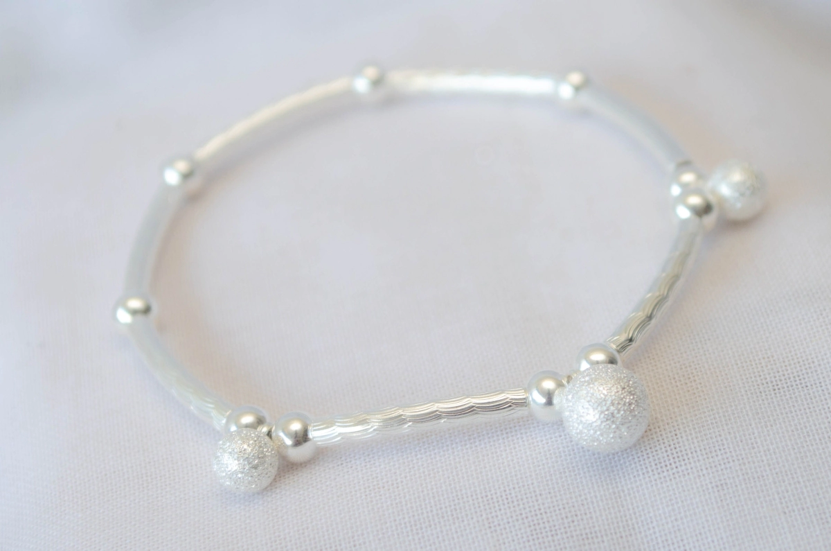 L-PU0199 Pulera elastizada bolitas colgantes arenadas