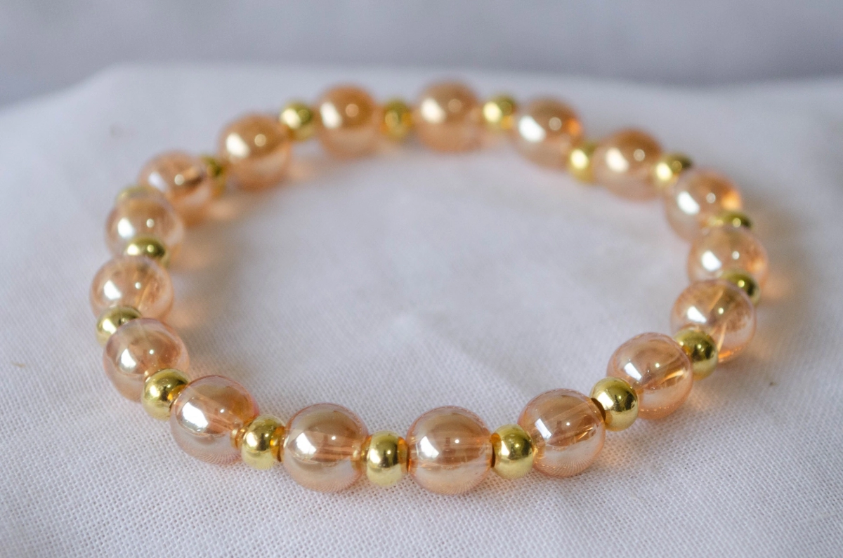 f-PU201 Pulsera elastizada perlas vidrio bolas doradas champagne