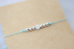 L-PU0211 Pulsera hilo chino celeste bolitas centro estrella