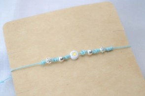 L-PU0212 Pulsera hilo chino celeste bolitas centro estrella