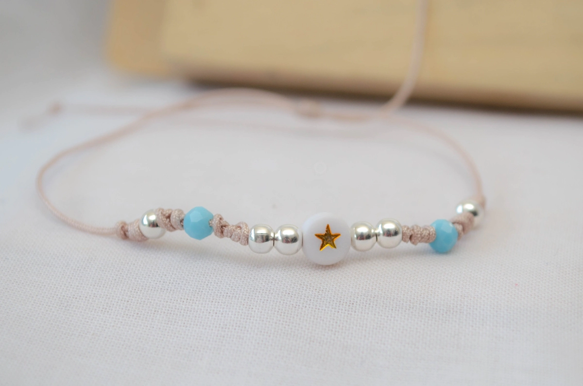 L-PU0214 Pulsera MUNDIAL hilo NUDE bolitas centro blanco estrella