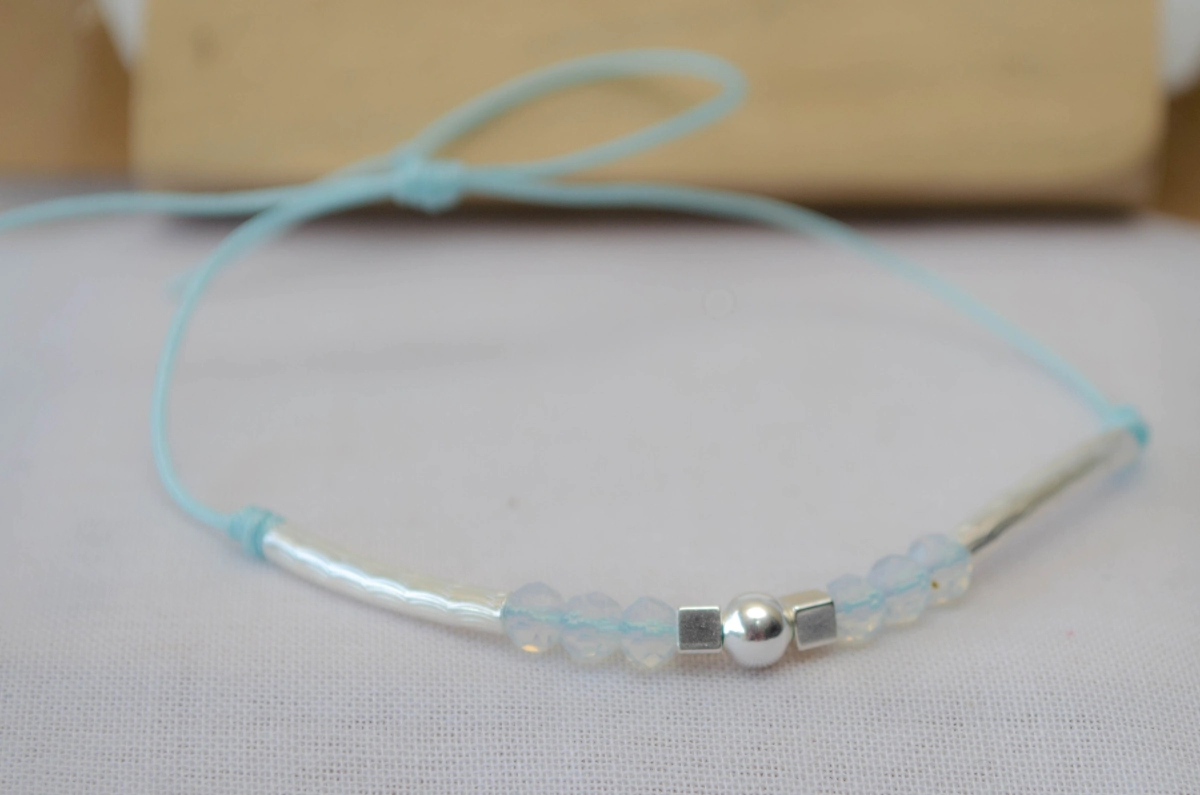 L-PU0220 Pulsera MUNDIAL bolitas tubos CELESTE