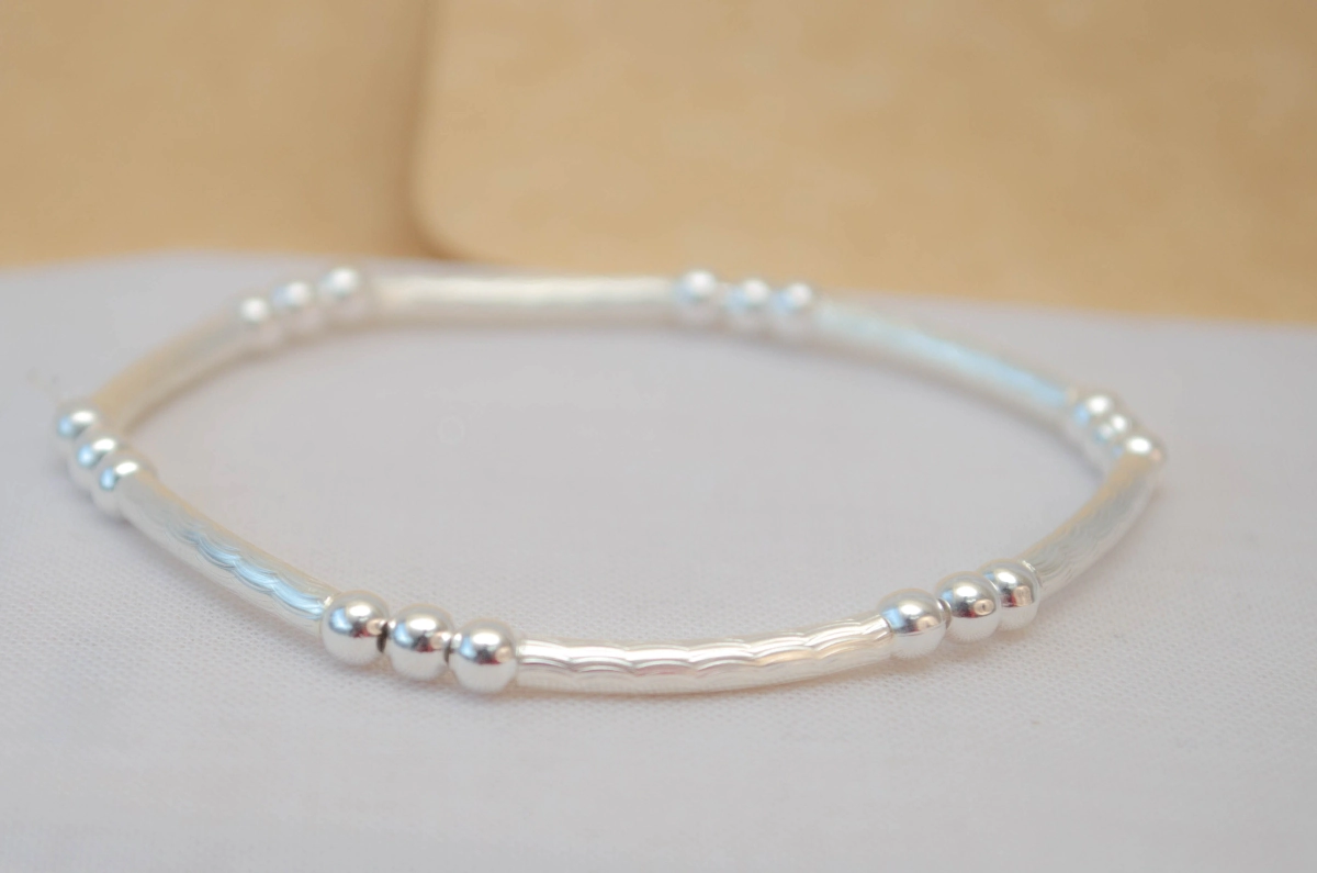 L-PU0218 Pulsera elastizada tubos bolitas