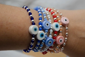 L-PU0227 Pulsera cristal centro ceramica ojo ROJO