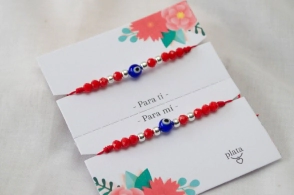 AMI0010 Setx2 pulseras hilo rojo cristales bolitas ojo turco