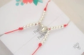 AMI0019 Setx2 pulseras hilo bolitas coraz�n imantado ROJO