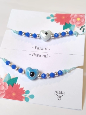 AMI0036 Setx2 pulseras hilo chino celeste CORAZON cer�mica azul y celeste bolitas azul 