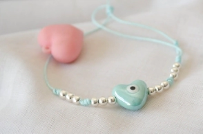 L-PU0235 Pulsera hilo celeste corazon ojo ceramica