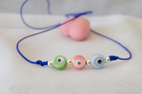L-PU0237 Pulsera hilo azul 3 ojos ceramica