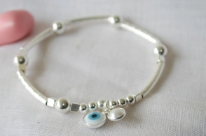 L-PU0242 Pulsera bolitas tubos elastizada OJO PERLA