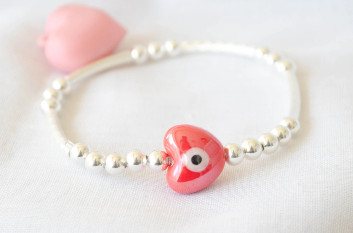 L-PU0238 Pulsera elastizada tubos bolitas corazon ojo ROJO